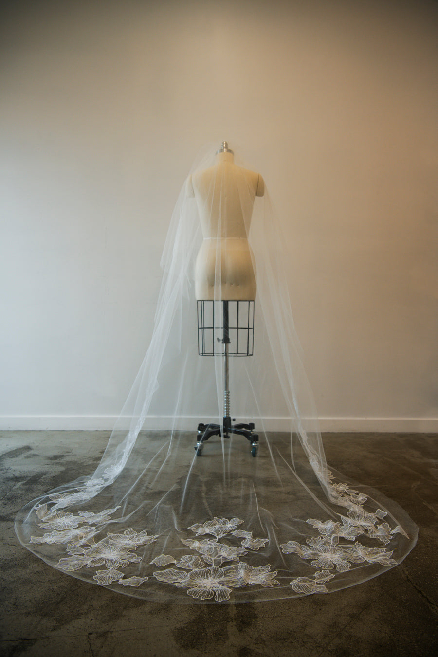 Full length back view of Chant d'Étoiles embroidered veil on mannequin