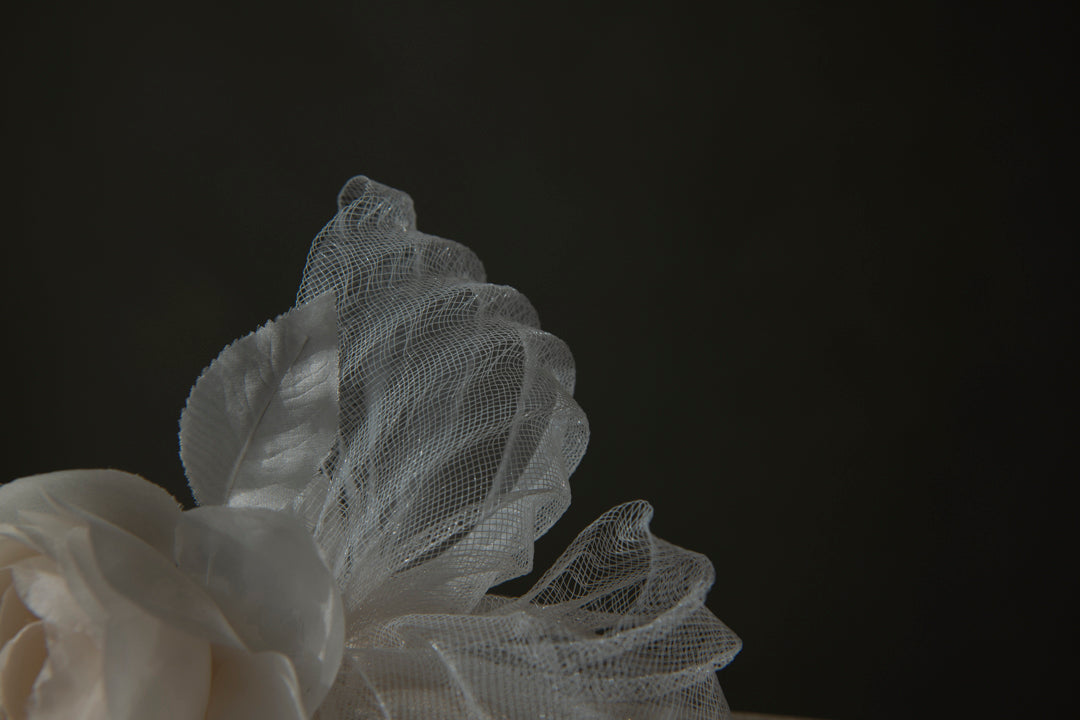 Close-up of pleated ivory horsehair crinoline detail on Renoncule brooch