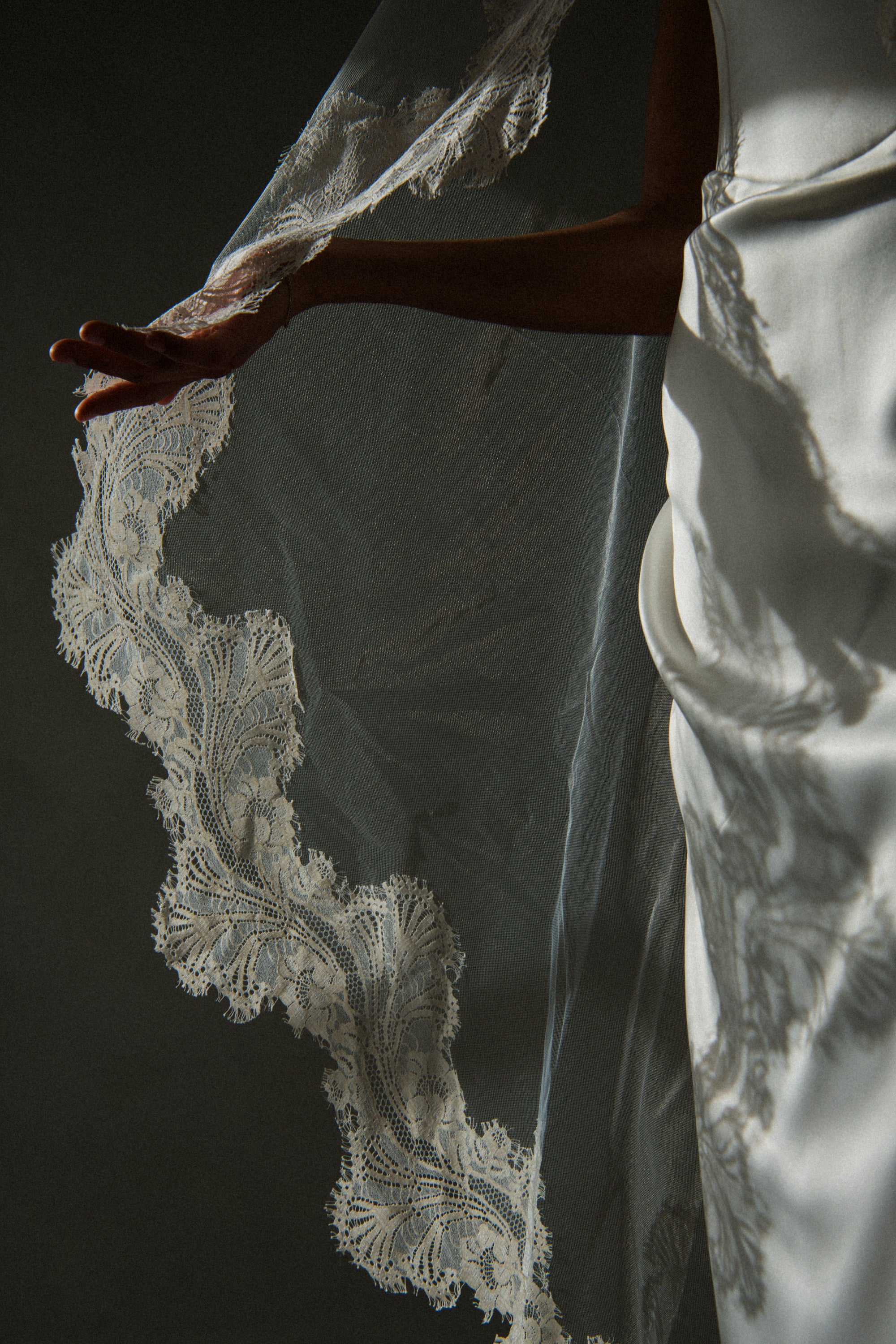 Clair de Lune cathedral veil natural drape showing lace pattern, editorial