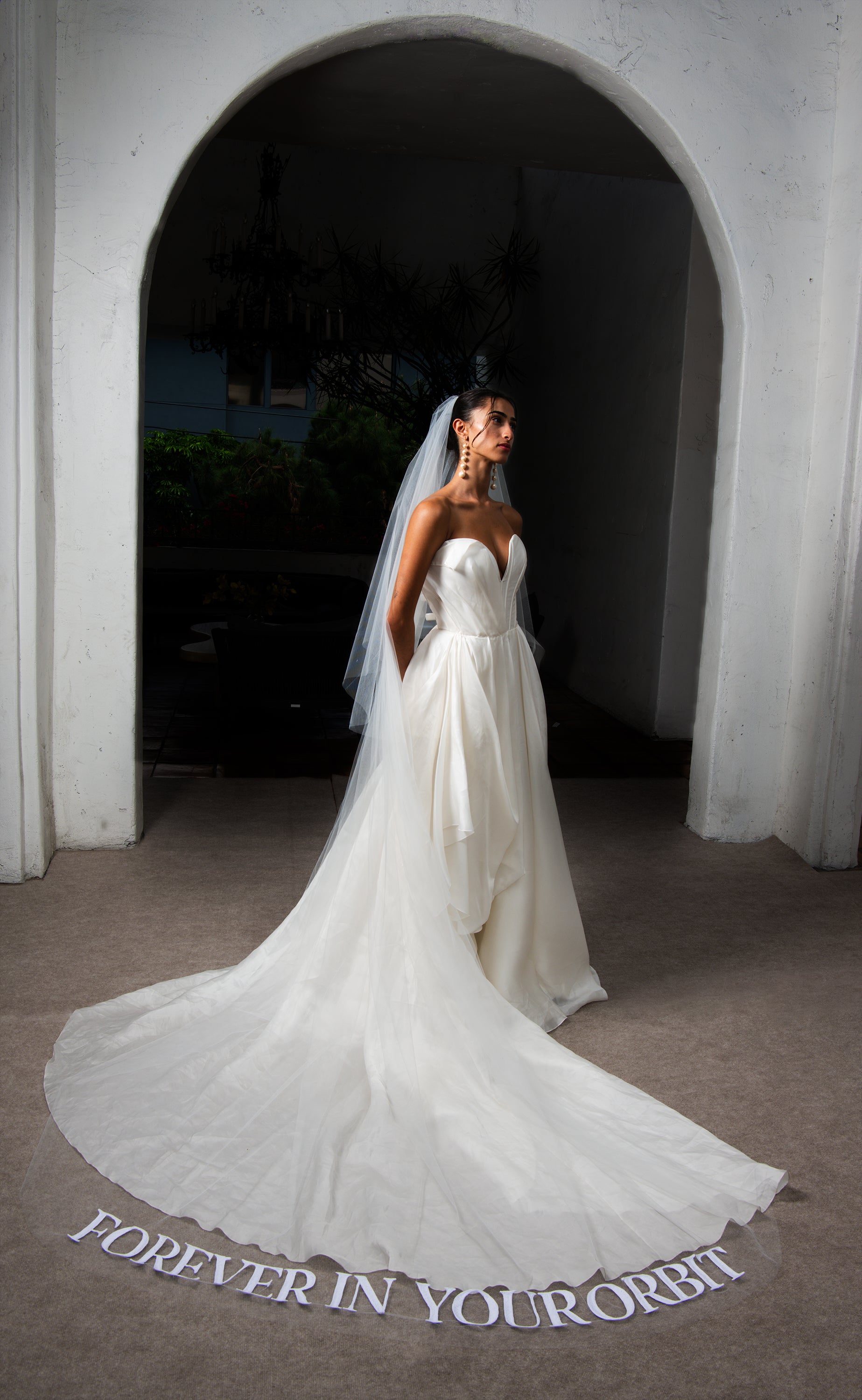 Orion cathedral veil spread under arch showing Forever in Your Orbit embroidered texts