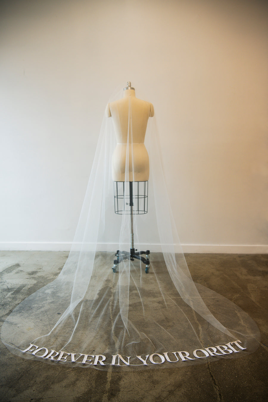 Orion cathedral veil on mannequin showing full embroidered text detail