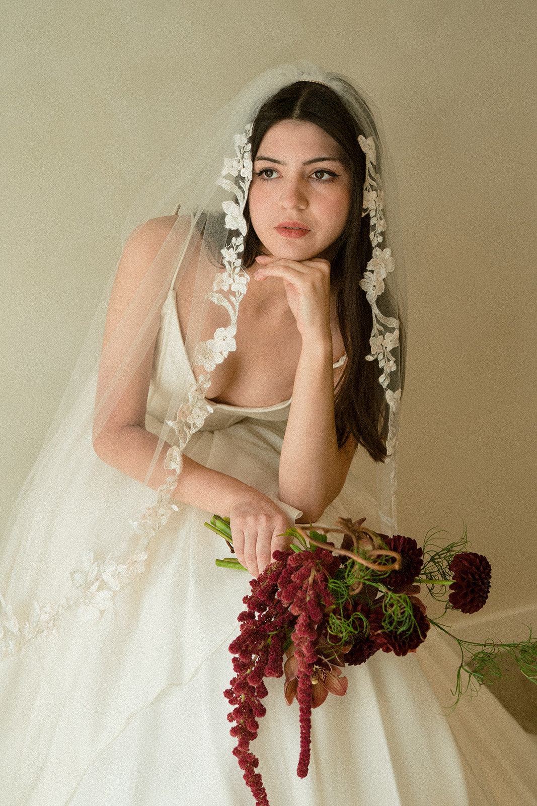 Primevère embroidered floral veil fingertip length on bride in natural light